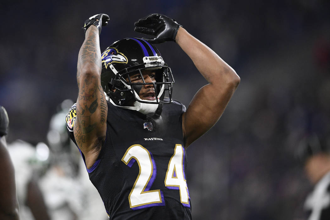 Baltimore Ravens cornerback Marcus Peters (24) gestures during the first half of an NFL footbal ...