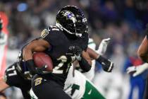 Baltimore Ravens running back Mark Ingram (21) runs with the ball during the first half of an N ...