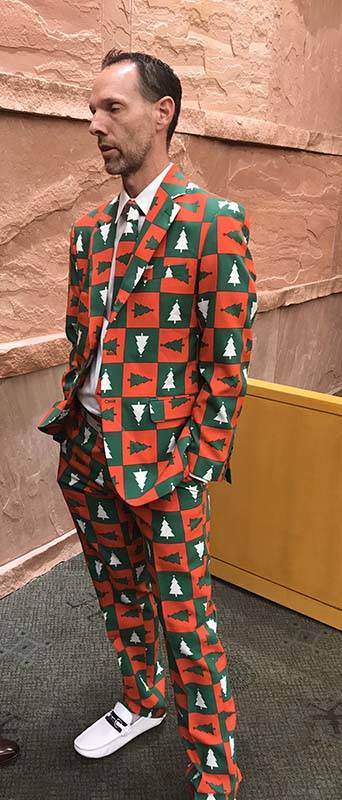 Clark County Commissioner Justin Jones, left, wore a Christmas suit to a Clark County zoning me ...