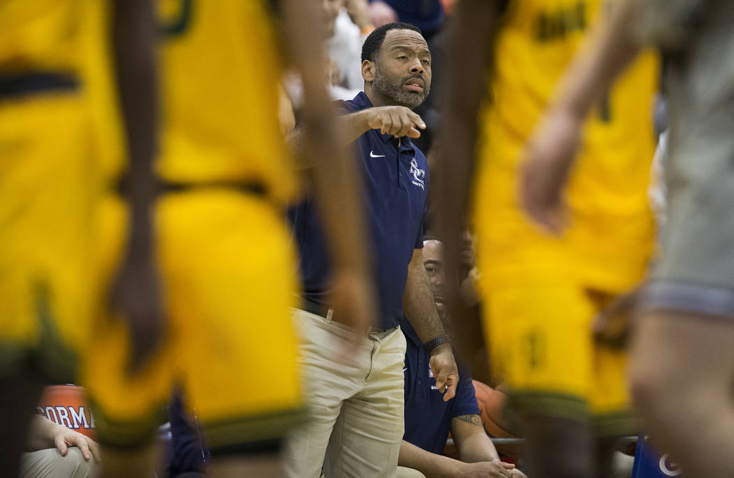 Sierra Canyon head coach Andre Chevalier coaches up his team in the second half during their ga ...