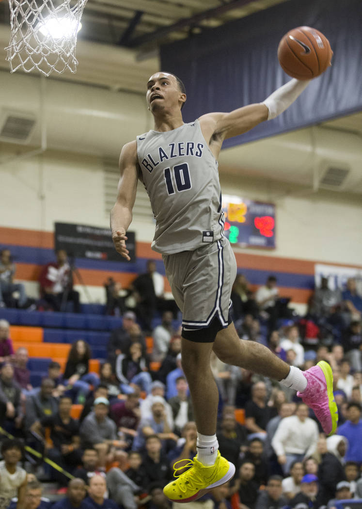 Sierra Canyon sophomore guard Amari Bailey (10) does break away windmill dunk in the second hal ...