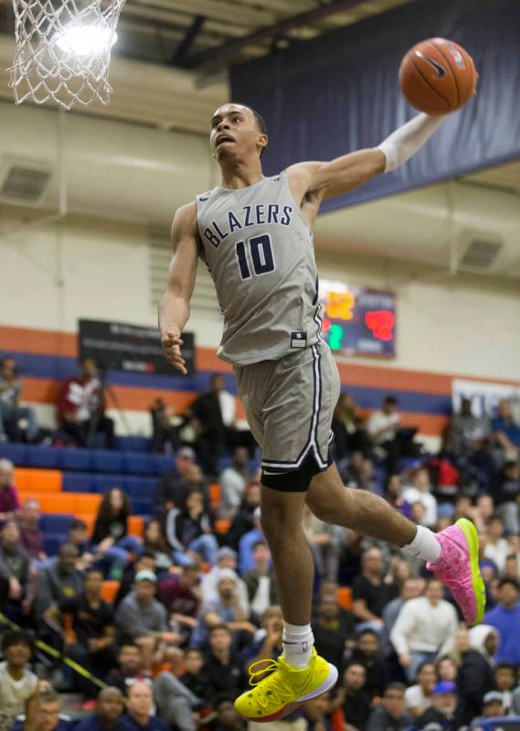Sierra Canyon sophomore guard Amari Bailey (10) does break away windmill dunk in the second hal ...