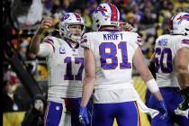 Buffalo Bills quarterback Josh Allen (17) celebrates after throwing a touchdown pass to tight e ...