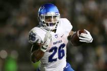 Buffalo running back Jaret Patterson (26) carries the ball during an NCAA college football game ...