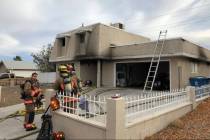 Crews battle a fire Wednesday, Dec. 18, 2019, on the 7200 block of William Anders Avenue in Las ...