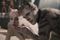 (from left) Victoria (Francesca Hayward) and Munkustrap (Robbie Fairchild) in "Cats," ...