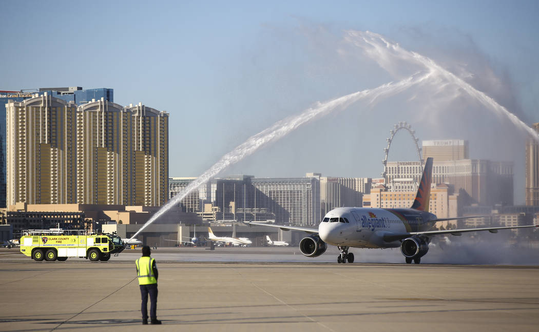 An Allegiant flight from San Antonio is welcomed with a water cannon salute, celebrating the 50 ...