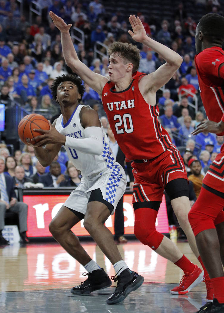 Kentucky's Ashton Hagans (0) looks for a shot as Utah's Mikael Jantunen (20) defends during the ...