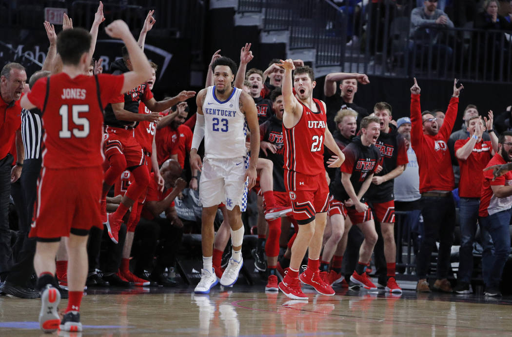 Utah's Riley Battin (21) celebrates after making a 3-point shot against Kentucky during the sec ...