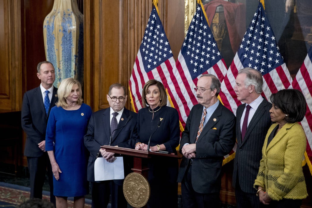 House Speaker Nancy Pelosi of Calif., center, accompanied by from left, House Intelligence Comm ...