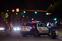 Metro officers investigate a hit-and-run crash at South Pecos Road and East Harmon Avenue that ...