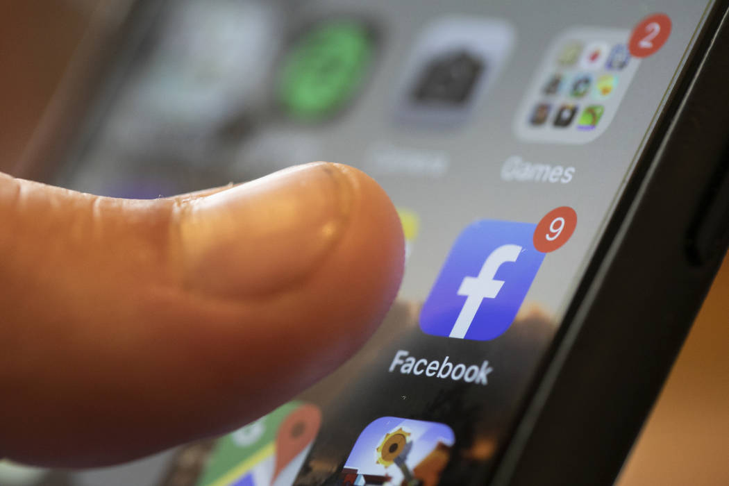 FILE - In this Aug. 11, 2019, file photo an iPhone displays the Facebook app in New Orleans. Fa ...
