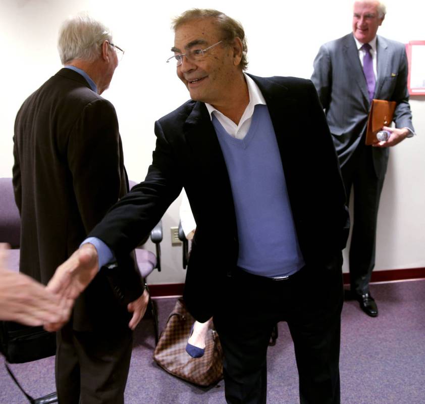 Phil Ruffin shakes hands with members of the news media while waiting to appear before Nevada G ...