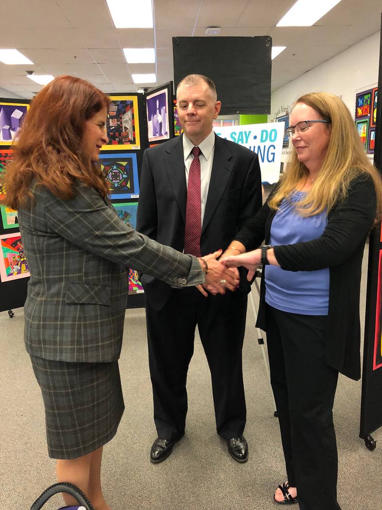 Mayor Debra March is pictured with Melissa and Earl Hawkes, parents of Caera Hawkes, at a kick- ...