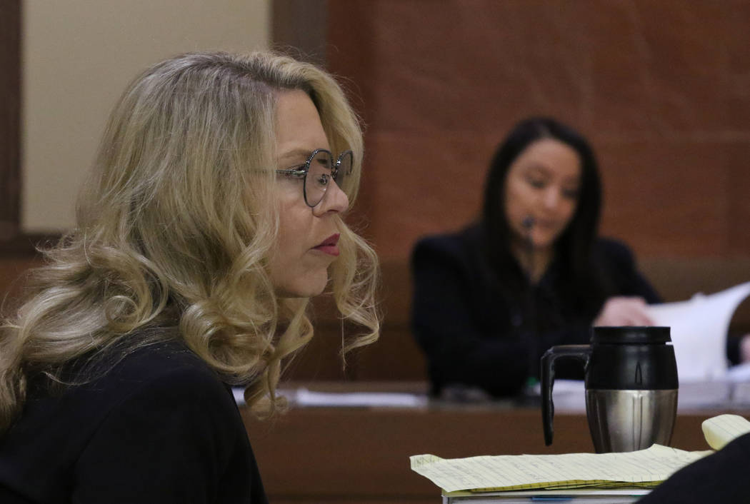 Las Vegas Justice of the Peace Melanie Andress-Tobiasson, left, listens to witness Elizabeth Co ...