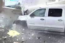 A man slammed his pickup truck through a baggage carousel area and into a car rental counter at ...