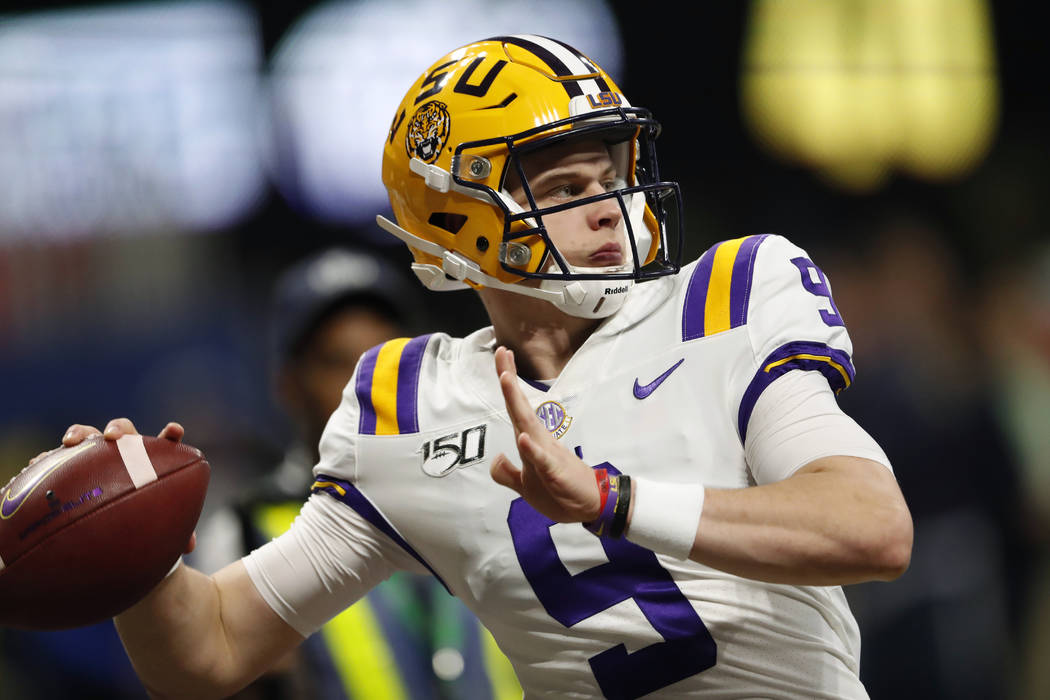 In this Dec. 7, 2019, file photo, LSU quarterback Joe Burrow (9) warms up before the Southeaste ...
