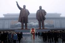 North Koreans visit the Mansu Hill to lay floral baskets and flowers to the bronze statues of t ...