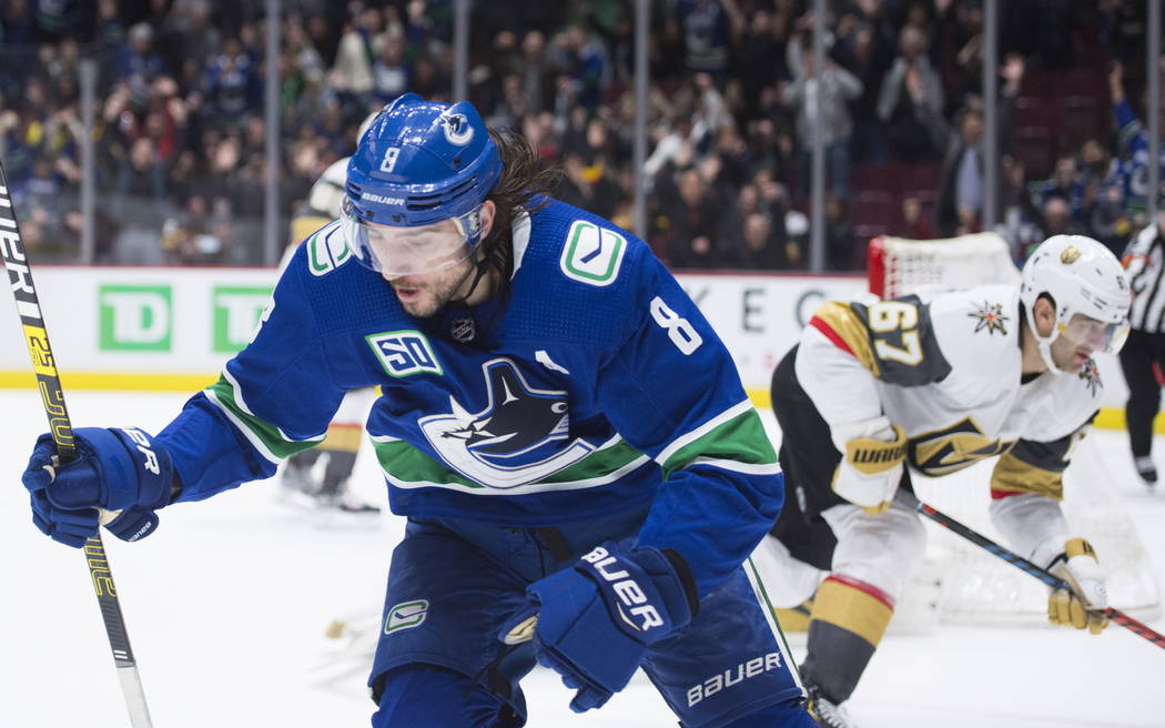 Vancouver Canucks defenseman Christopher Tanev (8) celebrates his overtime goal against the Veg ...