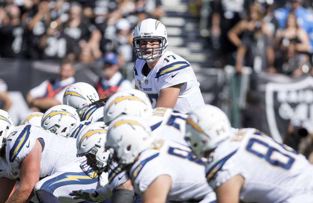 Los Angeles Chargers quarterback Philip Rivers (17) calls a play at the line of scrimmage durin ...