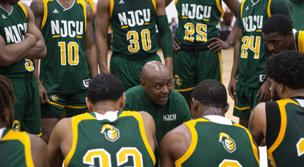 New Jersey City University's head coach Marc Brown speaks to his team in a timeout during the D ...