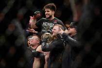 Henry Cejudo celebrates after a flyweight mixed martial arts championship bout against TJ Dilla ...
