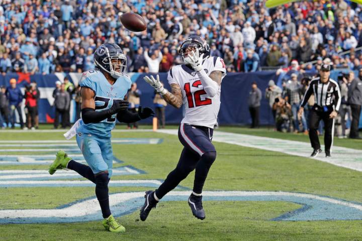 Houston Texans wide receiver Kenny Stills (12) catches a 12-yard pass for a touchdown as he is ...