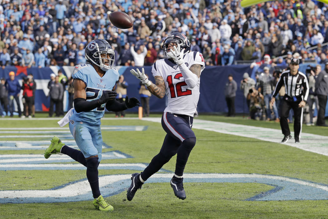 Houston Texans wide receiver Kenny Stills (12) catches a 12-yard pass for a touchdown as he is ...