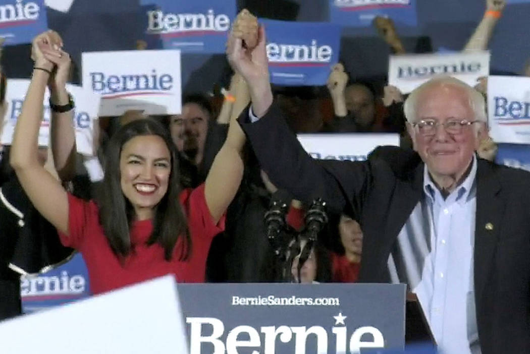 Democratic presidential candidate Sen. Bernie Sanders, I-Vt., right, and Rep. Alexandria Ocasio ...