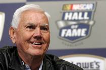 Former NASCAR driver and owner Junior Johnson smiles as he speaks to media about being named to ...