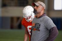 Oklahoma State's Kasey Dunn, associate head coach/receivers coach, watches during an NCAA colle ...