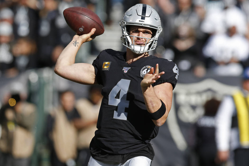 Oakland Raiders quarterback Derek Carr during the first half of an NFL football game in Oakland ...