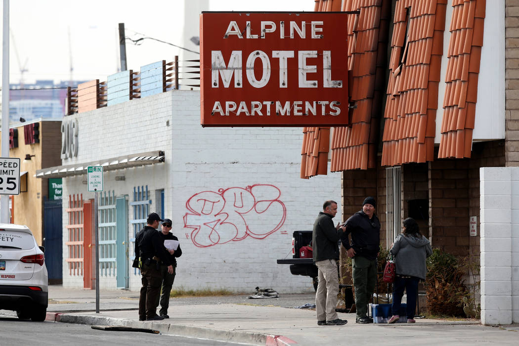 Fire officials talks to co-owner Malinda Mier, right, at Alpine Motel Apartments after a fire l ...