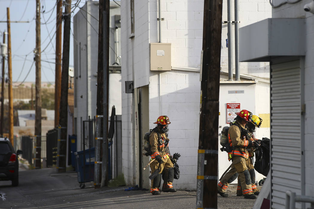 Las Vegas firefighters respond to the scene of a fire at the Alpine Apartment Motel that left 6 ...