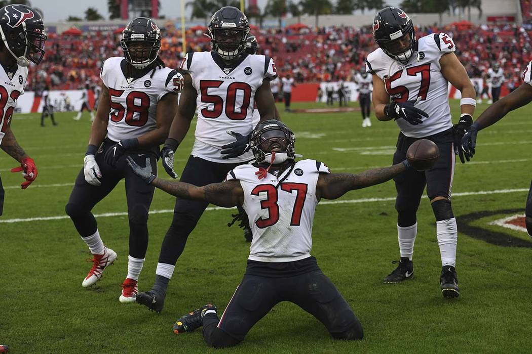 Houston Texans strong safety Jahleel Addae (37) celebrates after intercepting a pass by Tampa B ...