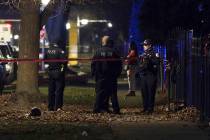 Chicago police guard a crime scene in the 5700 block of S. May Street in Chicago after several ...