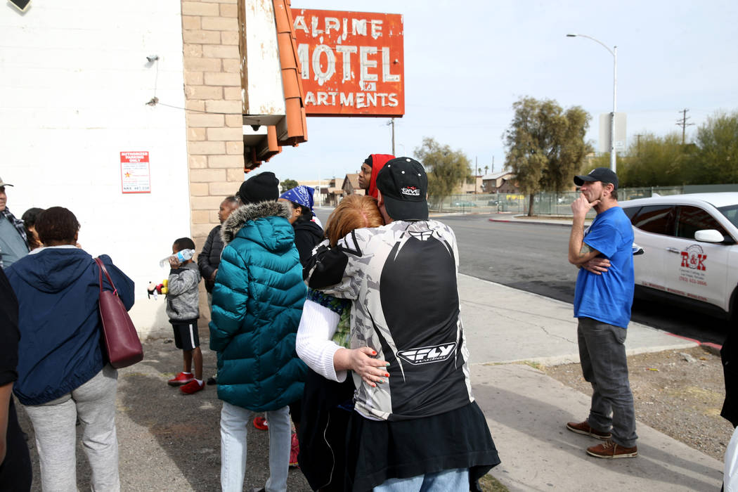 Residents Matthew Sykes comforts his wife Thelma at Alpine Motel Apartments after a fire left 6 ...