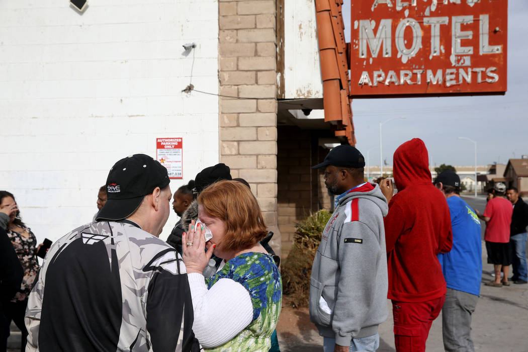 Residents Matthew Sykes comforts his wife Thelma at Alpine Motel Apartments after a fire left 6 ...