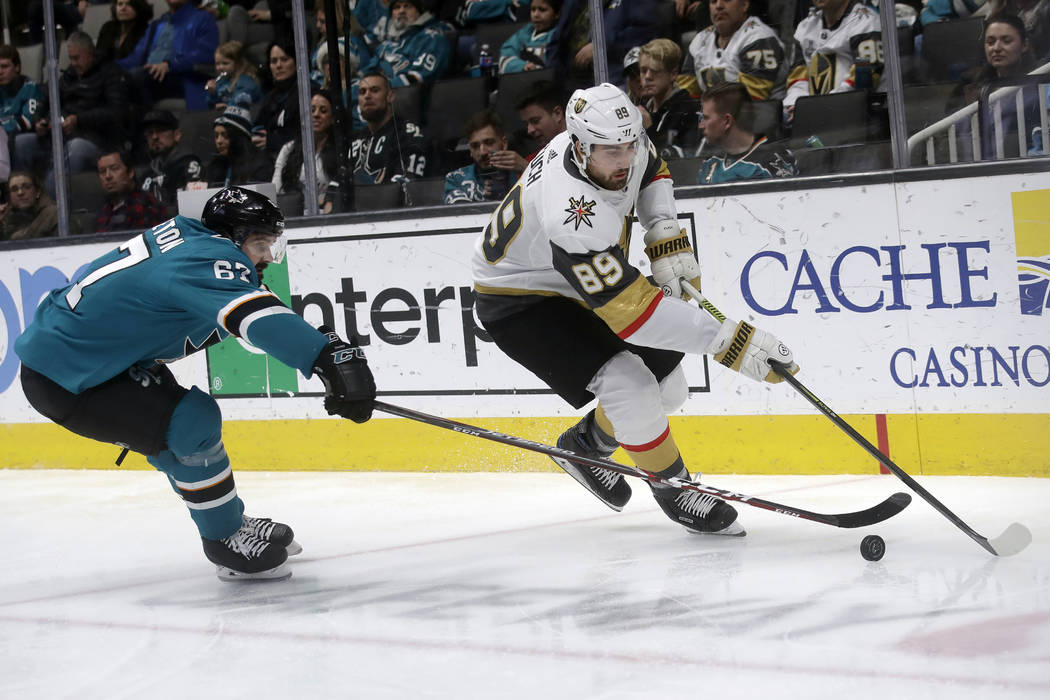 Vegas Golden Knights right wing Alex Tuch (89) skates in front of San Jose Sharks defenseman Ja ...