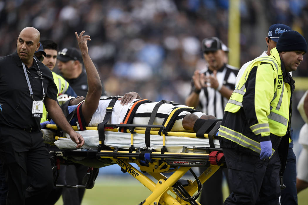 Oakland Raiders cornerback Trayvon Mullen is taken off the field after being hurt during the se ...