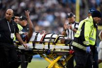Oakland Raiders cornerback Trayvon Mullen is taken off the field after being hurt during the se ...