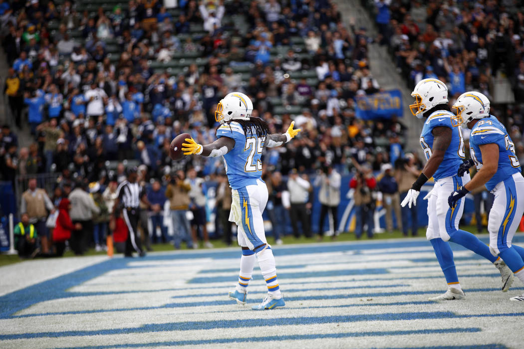 Los Angeles Chargers running back Melvin Gordon (25) celebrates his touchdown score as tight en ...