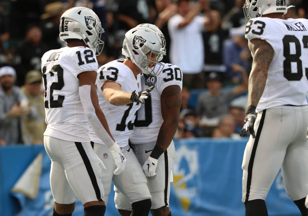 Oakland Raiders wide receiver Hunter Renfrow (13) celebrates his touchdown with wide receiver Z ...