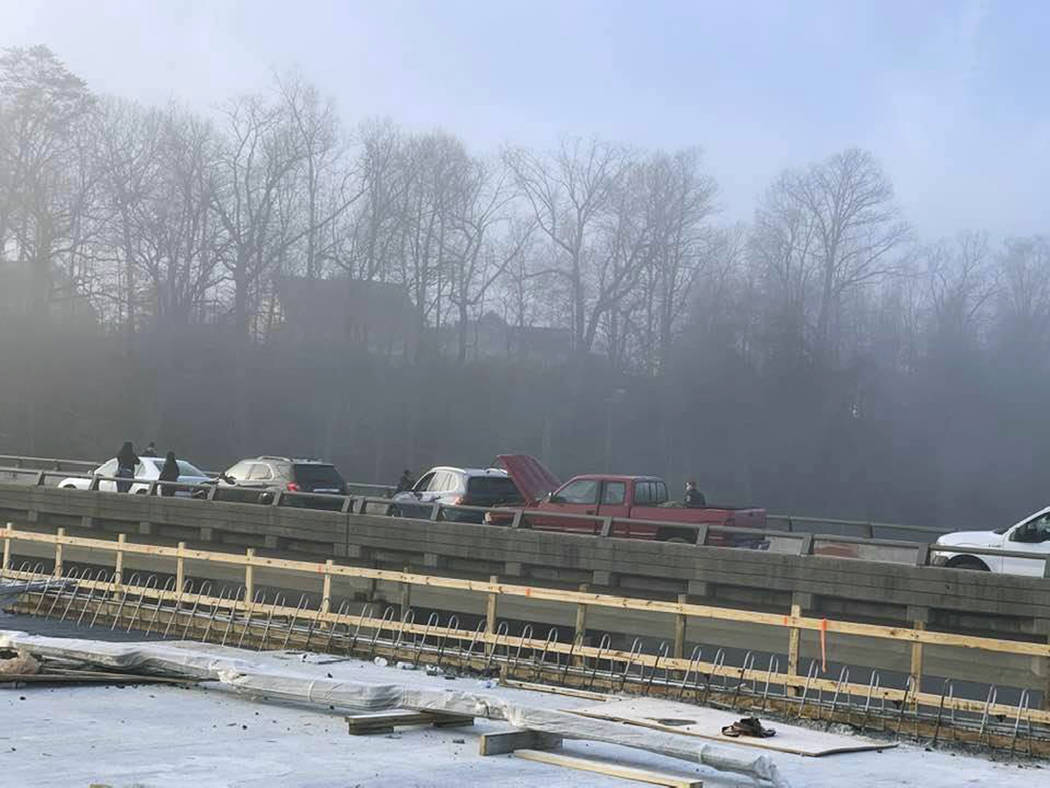Drivers remain on the scene of a multi-vehicle pileup on Interstate 64 in York County, Va., Sun ...