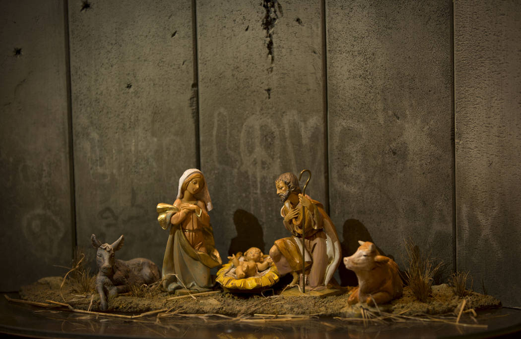 A new artwork dubbed "Scar of Bethlehem" by the artist Banksy is displayed in The Wal ...