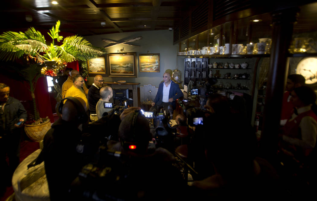 Wisam Salsa, general manager of the Walled Off hotel, speaks to journalists about a new artwork ...