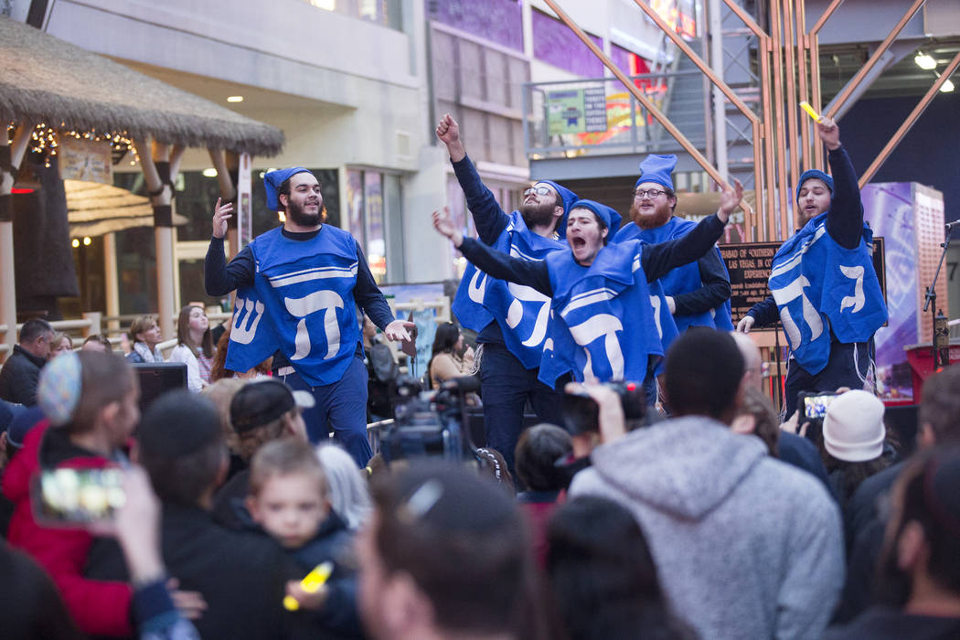 The Dancing Dreidels perform at a menorah lighting hosted by Chabad of Southern Nevada for the ...