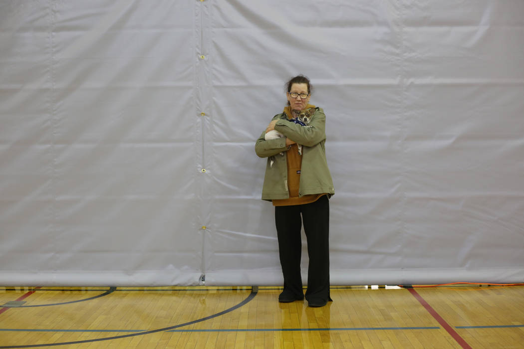 Alpine Motel Apartments resident Christina Farinella holds her dog Baby while Farinella waits t ...