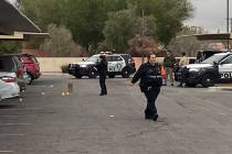 Metropolitan Police Department investigators process a shooting scene on the 2900 block of Mt. ...