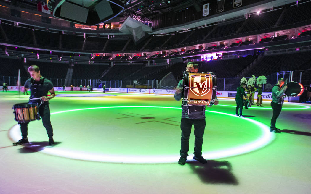 The Drumbots practice on the ice during a rehearsal for the Vegas Golden Knights holiday perfor ...
